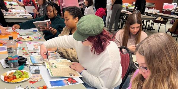 Illinois State residential students working on creating personalized vision boards.